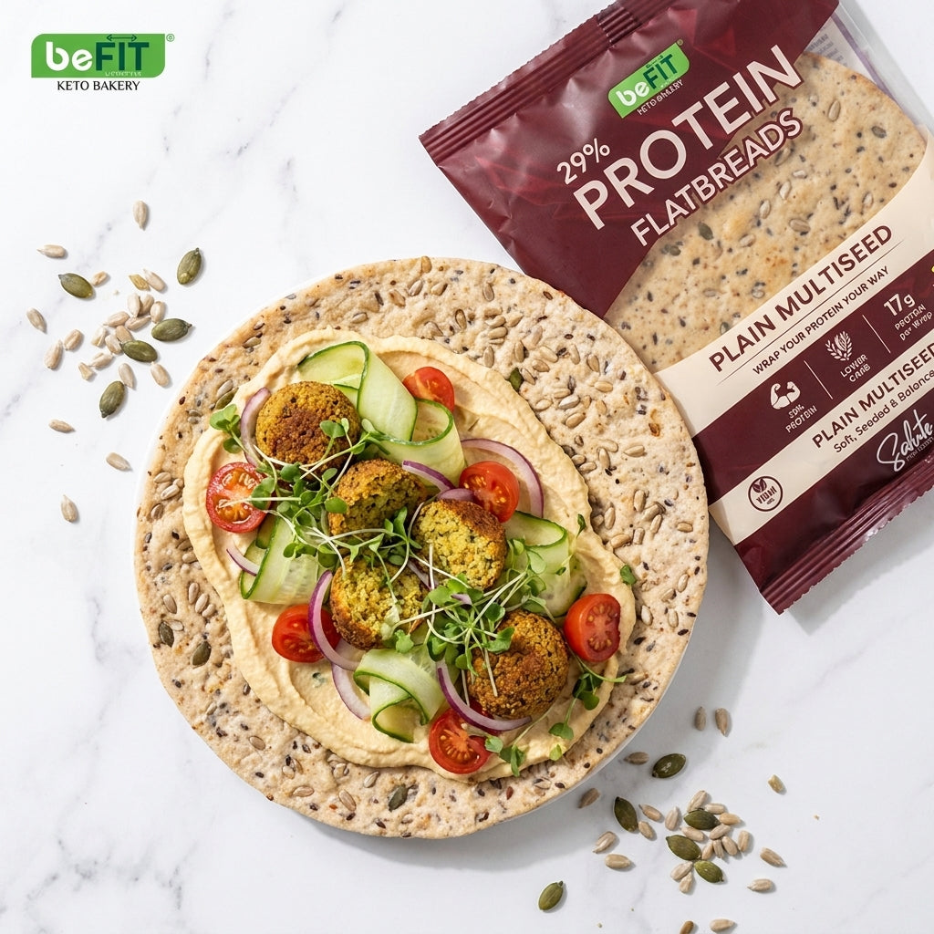 Befit Plain Multiseed protein flatbread with falafel, hummus and fresh veggies, flat-lay lifestyle